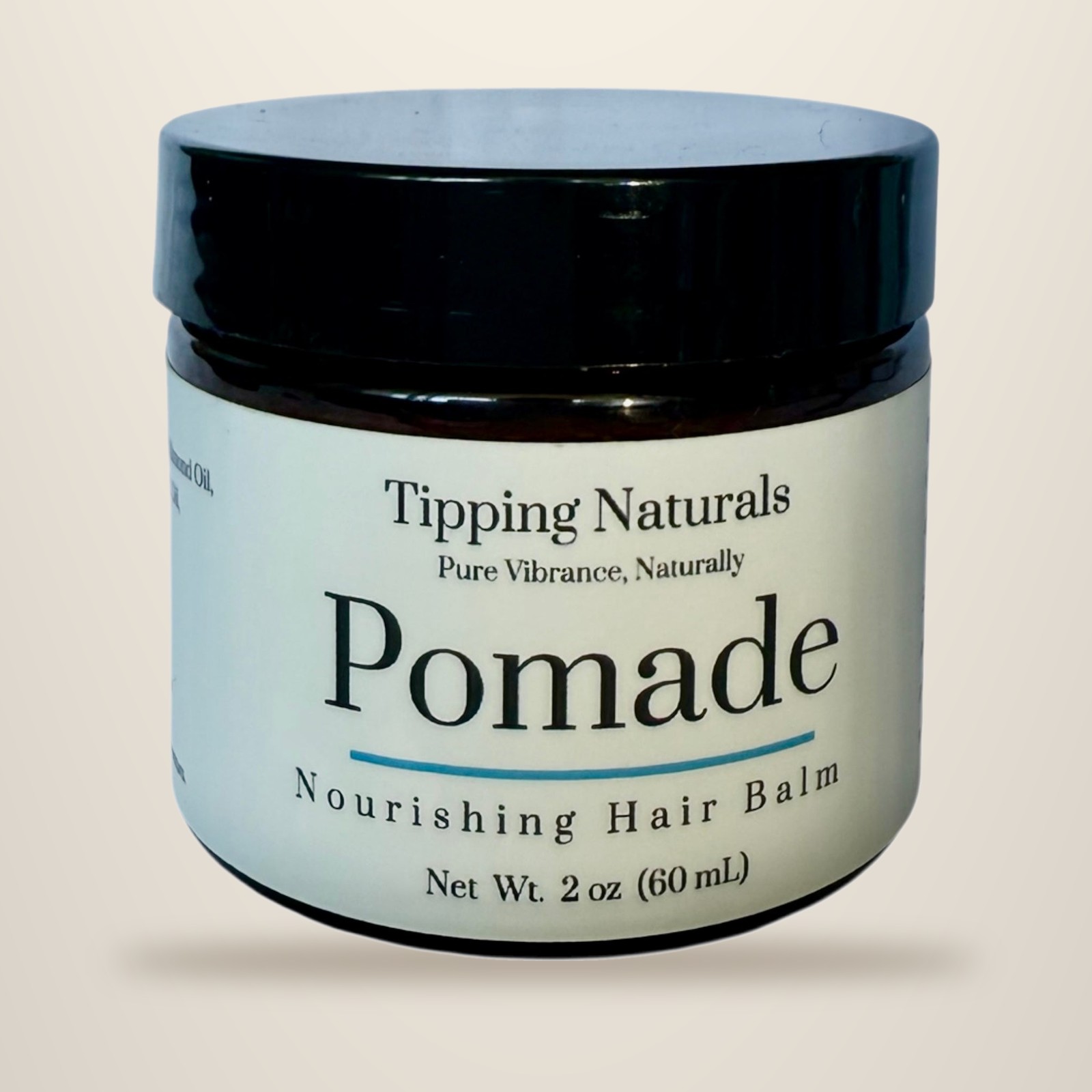 Square jar of Tipping Naturals grass-fed Wagyu tallow pomade with a kraft label
