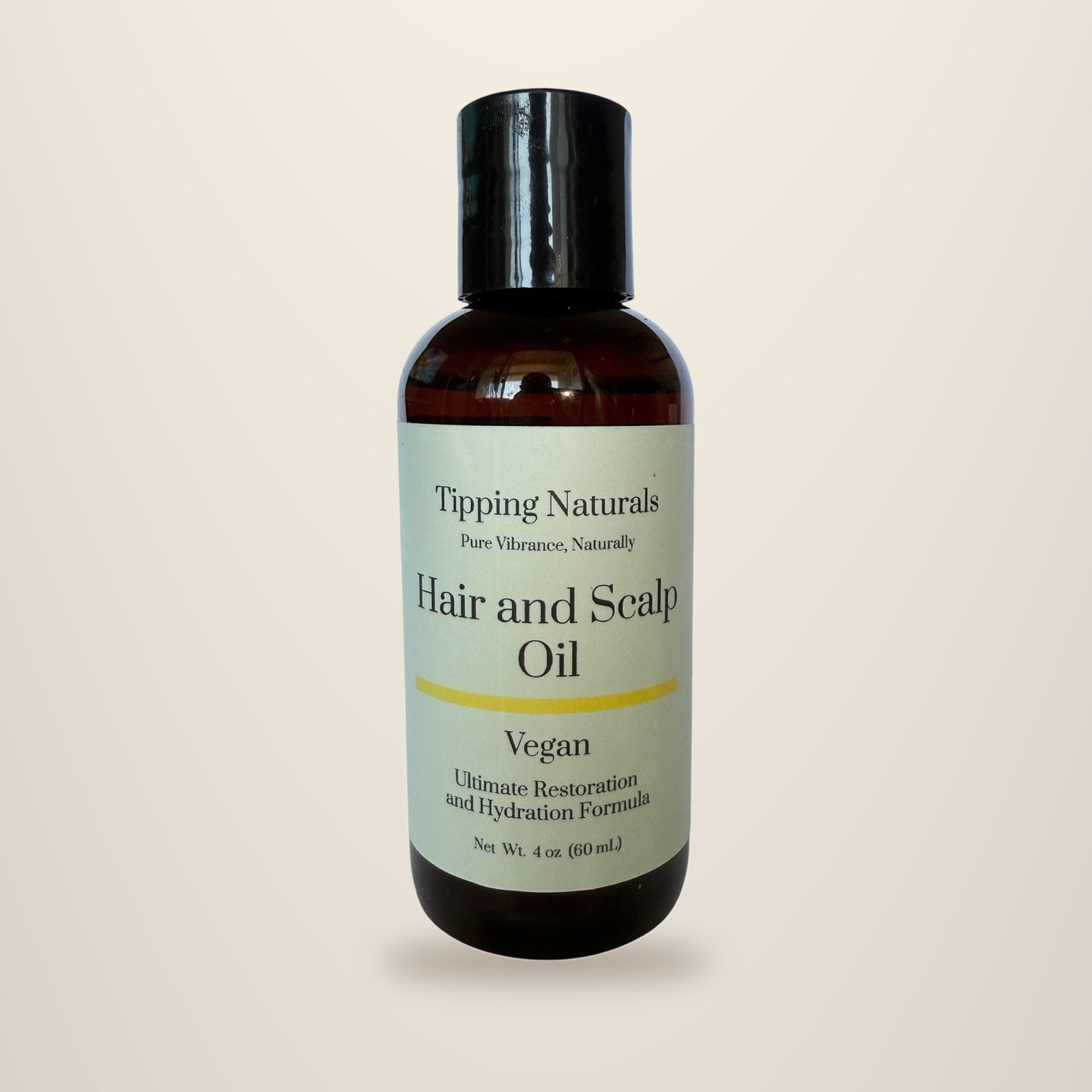 Dropper bottle of Tipping Naturals vegan hair and scalp oil